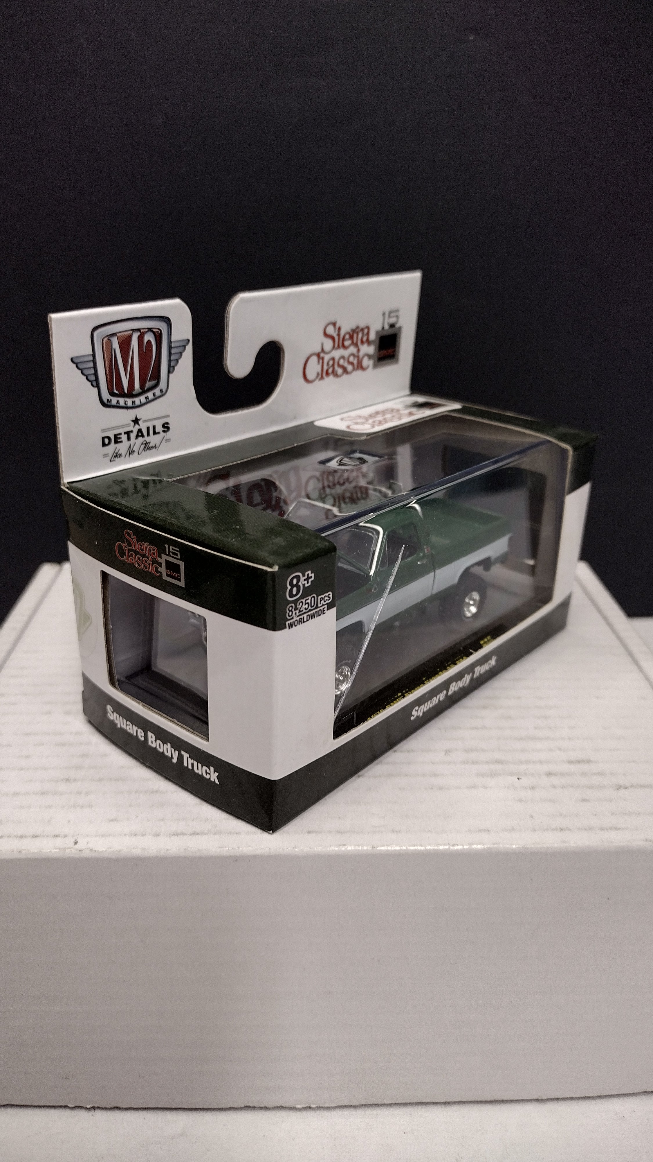 Modern 2020s M2 Machines Sierra Classic 1976 GMC Sierra Grande 15 4x4 (Green/White) 1:64 (New in Acrylic Box - Factory Sealed)