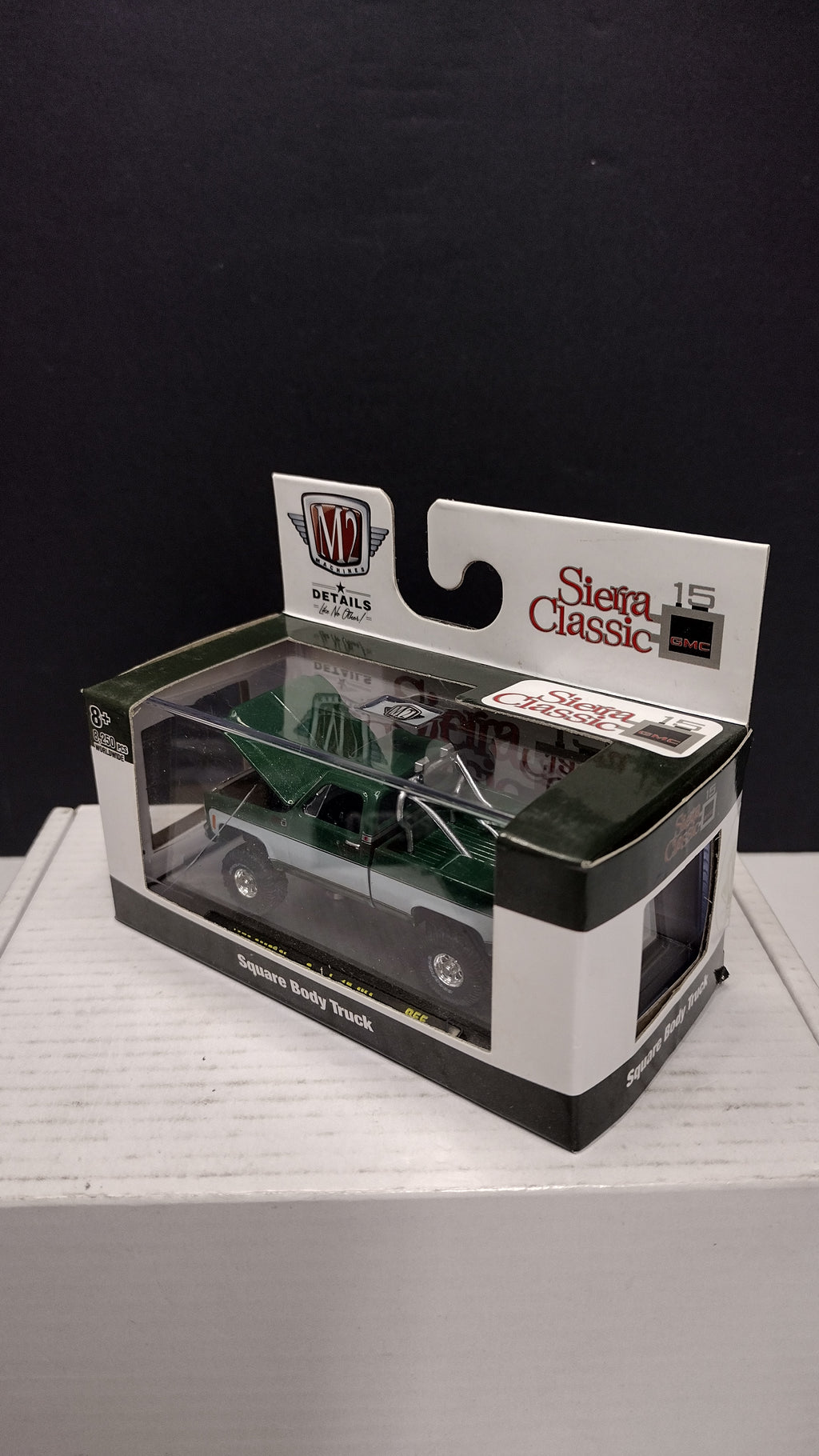 Modern 2020s M2 Machines Sierra Classic 1976 GMC Sierra Grande 15 4x4 (Green/White) 1:64 (New in Acrylic Box - Factory Sealed)