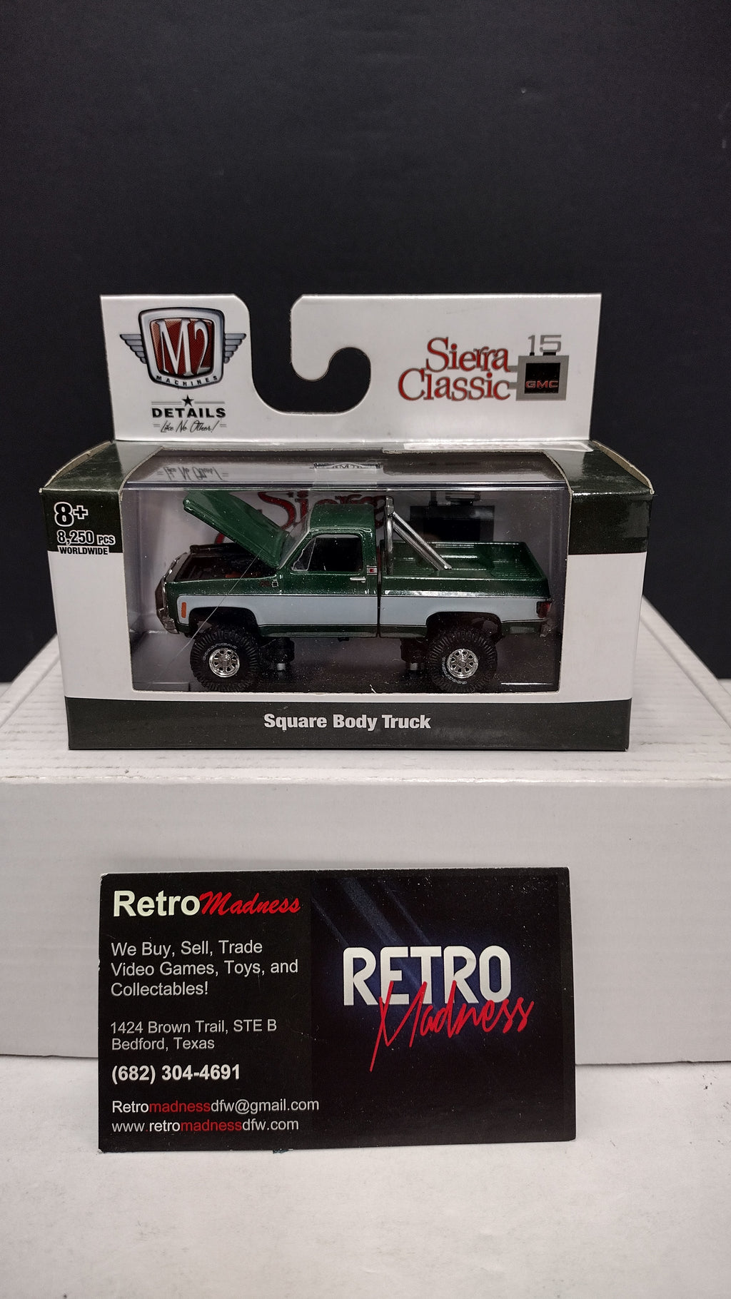 Modern 2020s M2 Machines Sierra Classic 1976 GMC Sierra Grande 15 4x4 (Green/White) 1:64 (New in Acrylic Box - Factory Sealed)