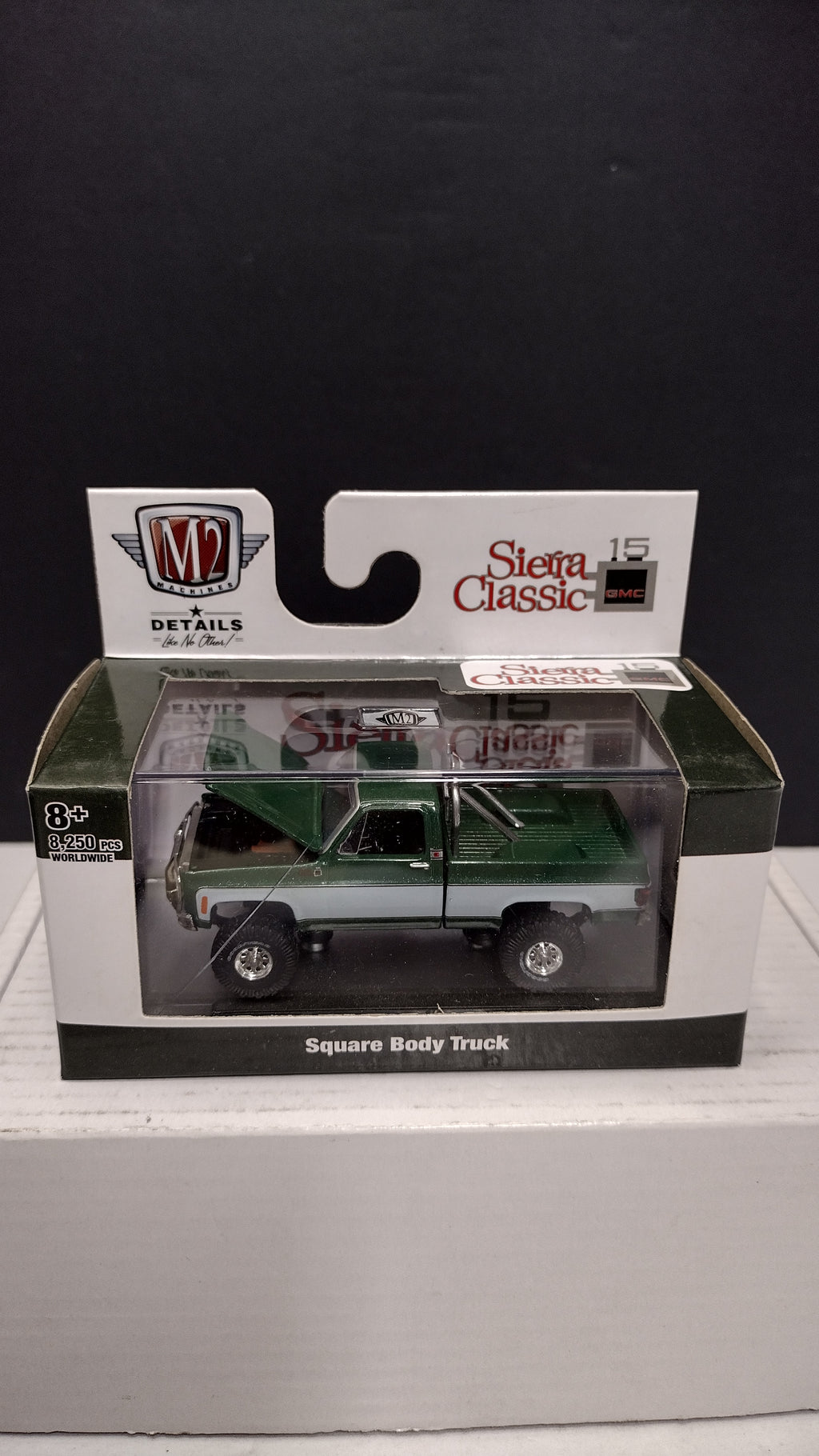 Modern 2020s M2 Machines Sierra Classic 1976 GMC Sierra Grande 15 4x4 (Green/White) 1:64 (New in Acrylic Box - Factory Sealed)