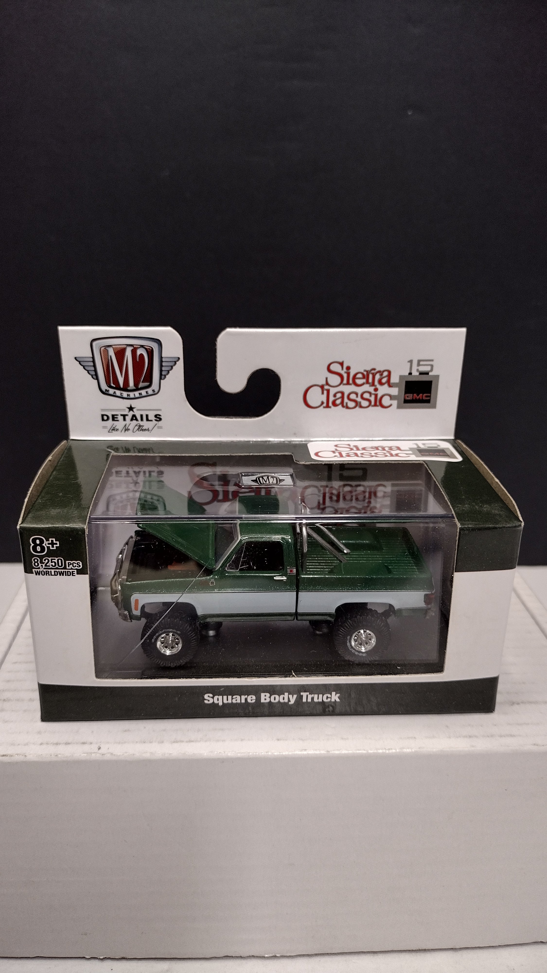 Modern 2020s M2 Machines Sierra Classic 1976 GMC Sierra Grande 15 4x4 (Green/White) 1:64 (New in Acrylic Box - Factory Sealed)