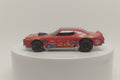 A pre-owned red Hot Wheels Redline model of a Ford Grand Torino with visible wear and tear.